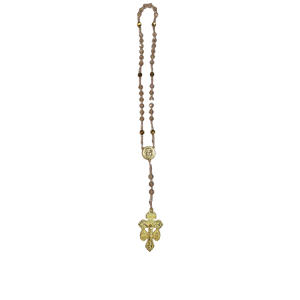 A rosary-style necklace with brown beads, featuring a gold medallion and an ornate gold cross pendant, arranged vertically on a white background.
